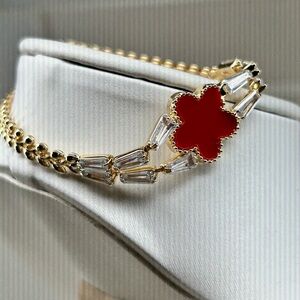 Elegant Gold and Red Clover Bracelet